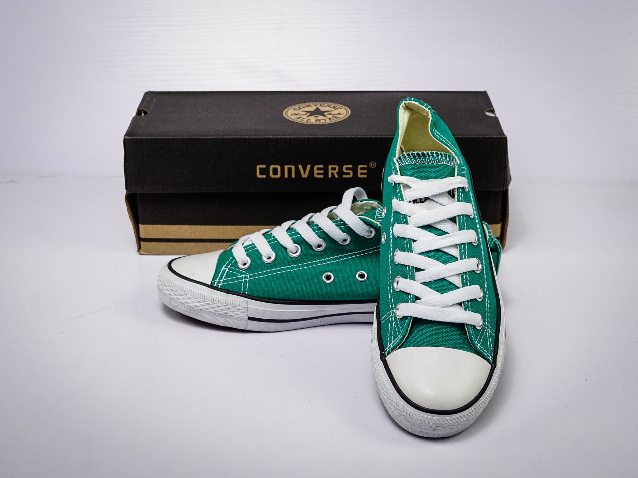 Converse verdes bajas best sale